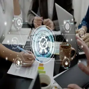 Team members working on documents with digital quality icons